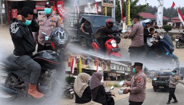 Kabut Asap Ganggu Aktivitas Warga, Polsek Kabun Bagikan 100 Masker